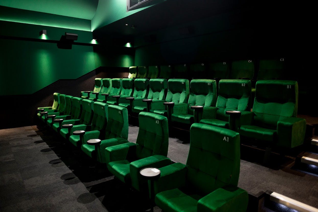 Curzon Camden cinema with plush green seating for private screenings and events.