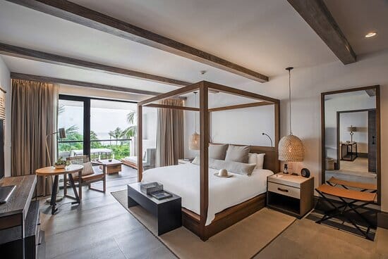 Elegant hotel room with a work desk, perfect for retreats and executive meetings.