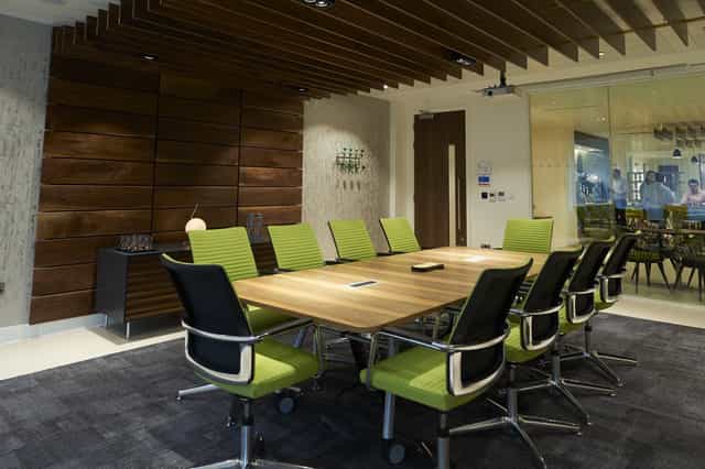 Modern conference room at etc.venues Fenchurch Street with ergonomic green chairs.