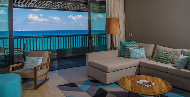 Stylish lounge area with ocean view at Grand Hyatt Playa del Carmen for networking events.