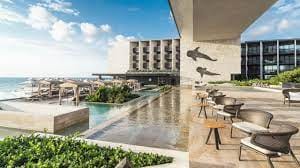 Grand Hyatt Playa del Carmen bedroom, modern design, ideal for events and retreats.