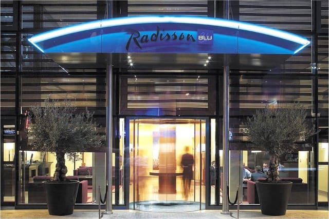 Radisson Blu Hotel Paris entrance, modern facade, ideal for corporate events and meetings.