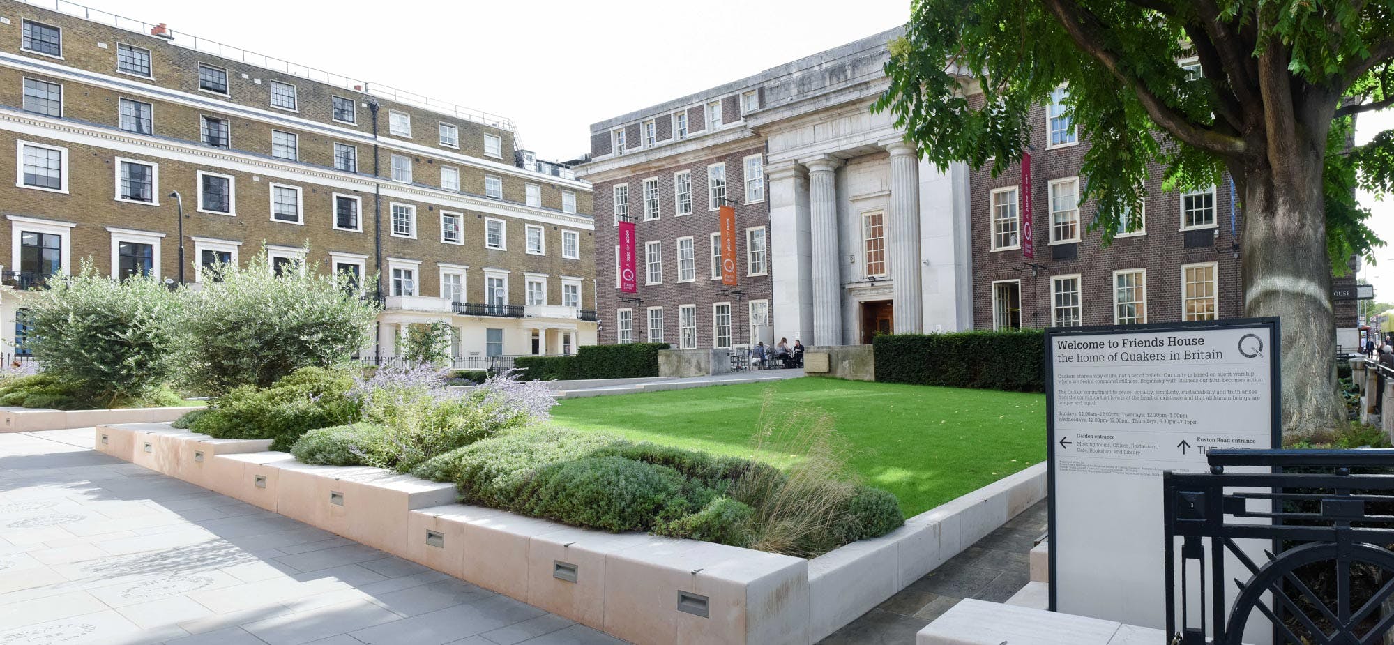 Outdoor event space at Friends House with manicured lawn and elegant architecture.