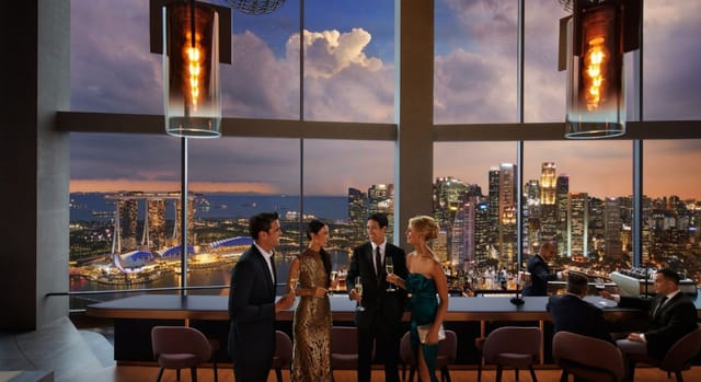 Sophisticated networking event at Skai Restaurant with city skyline backdrop.