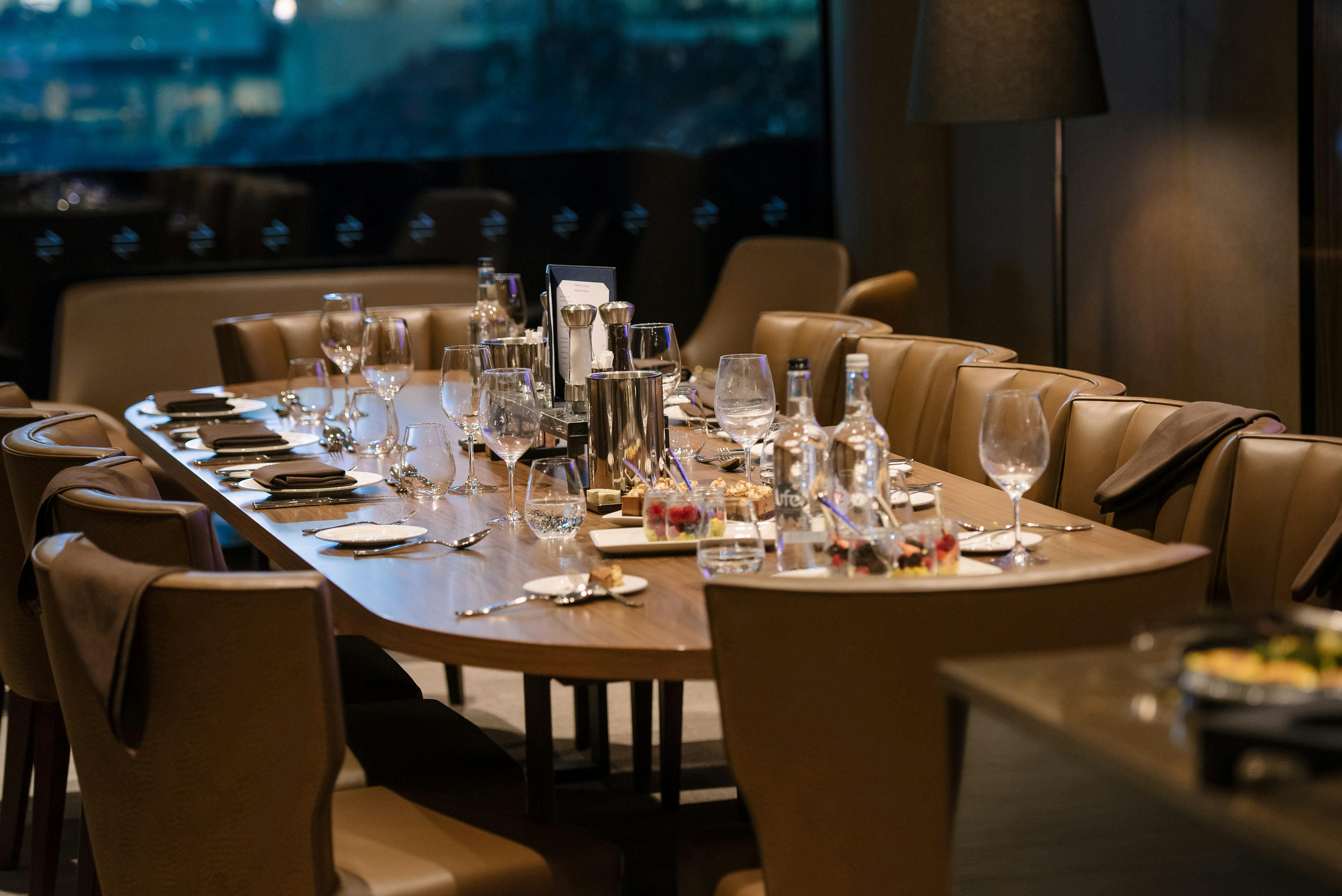 Sophisticated dining setup in Sideline Suites, Tottenham Hotspur Stadium for corporate events.