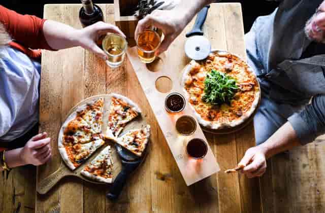 Cider Snug dining setup with wooden table for networking and team-building events.