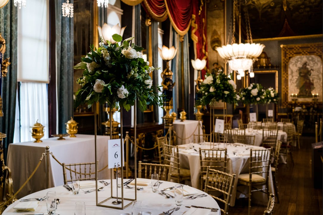 Elegant Banqueting Room in Royal Pavilion with floral centerpieces for weddings and galas.