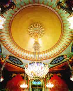 Opulent Royal Pavilion Music Room with intricate ceiling and grand chandelier for elegant events.