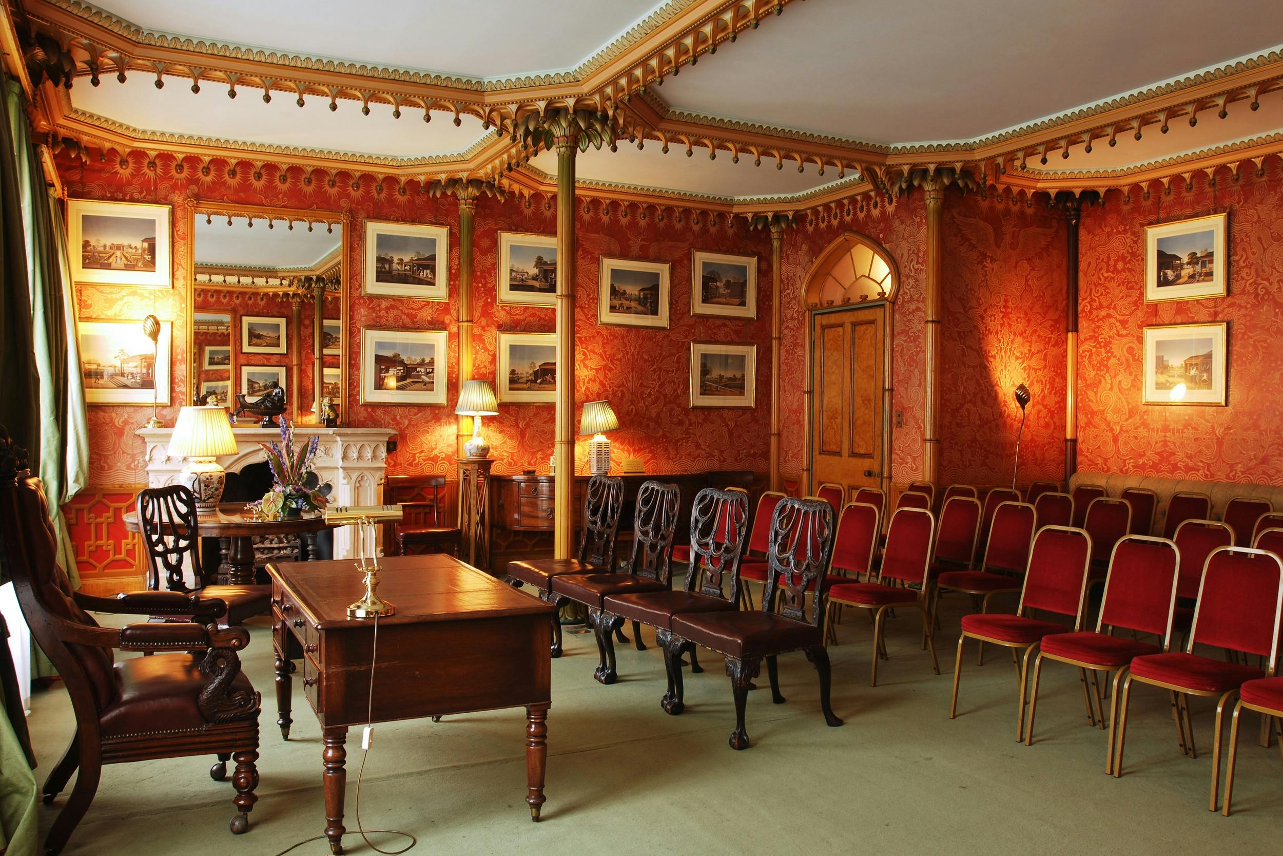 Red Drawing Room in Royal Pavilion, elegant red decor for meetings and events.