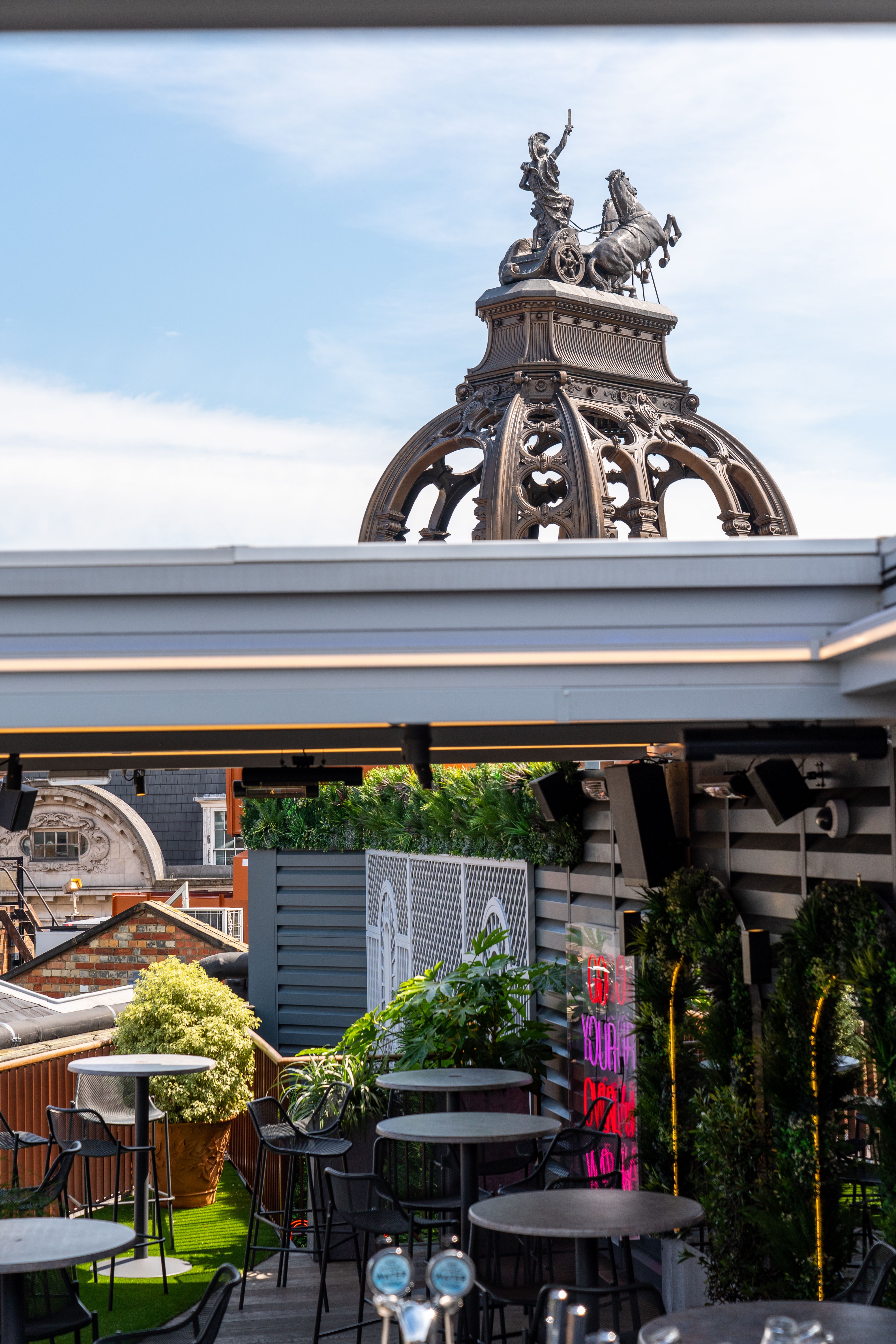Stylish rooftop bar with ornate dome, perfect for upscale events and gatherings. - Banner