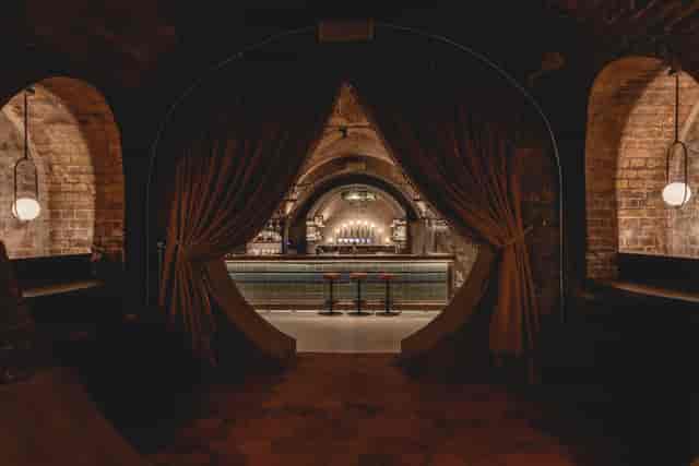 Whiskey Vault bar with arched entryways, perfect for cocktail receptions and gatherings.