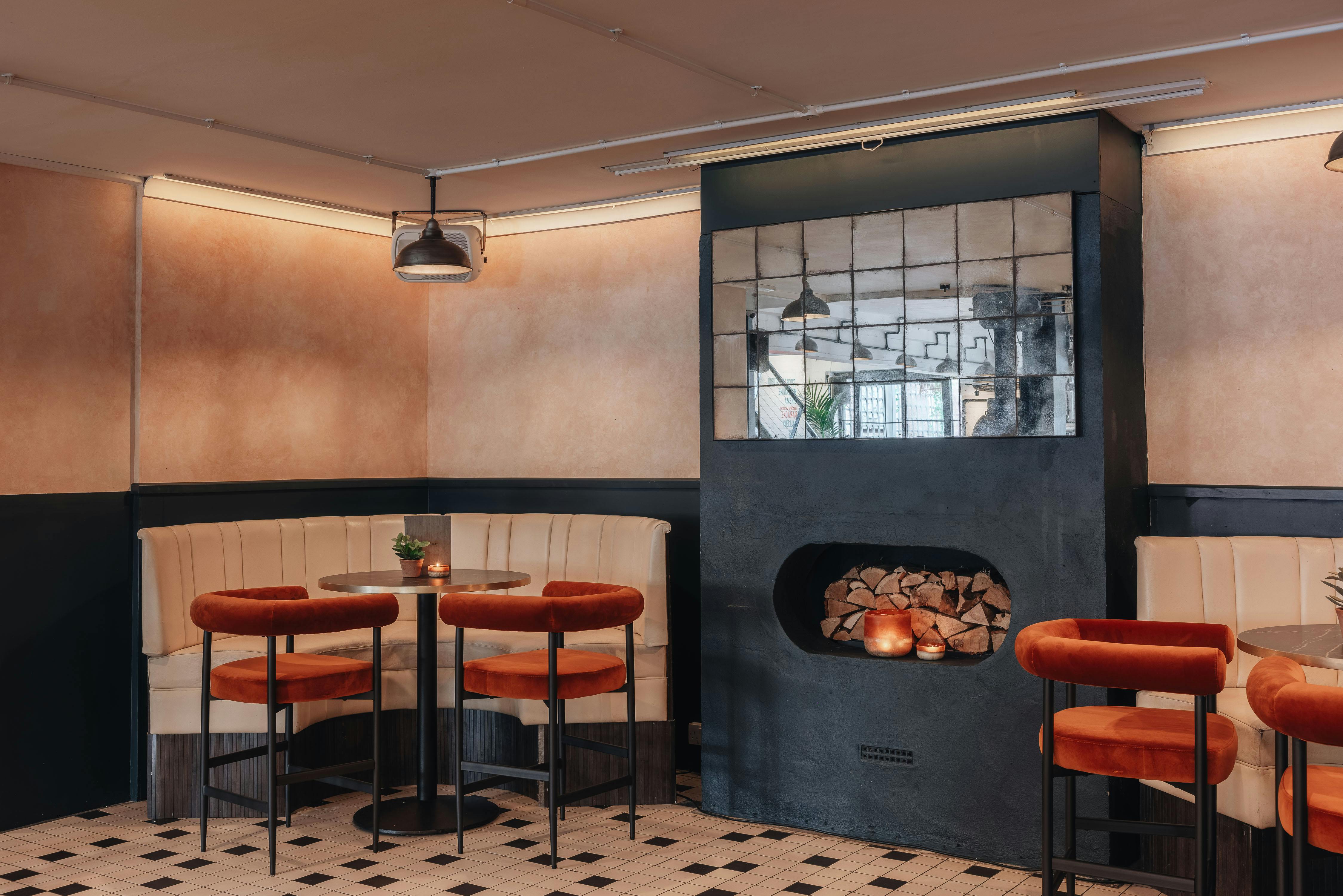 Stylish meeting space with cozy seating for networking events at The Hideaway, Balham.