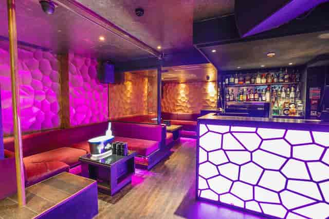 VIP Room at Chinawhite: stylish lounge for networking events with vibrant lighting.