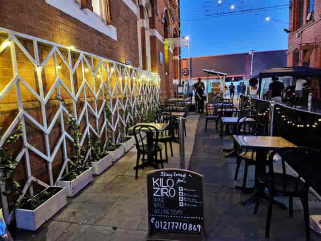 Outdoor event space at KILO ZIRO with warm lighting, ideal for gatherings and networking.
