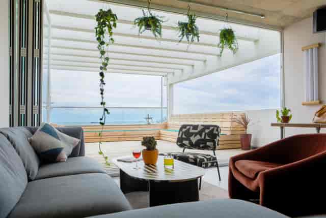 Modern lounge with water view, ideal for networking events and casual gatherings.