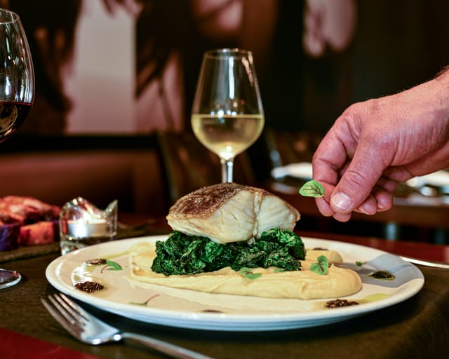 Elegant plated dish at Exclusive Use in People Restaurant for upscale event catering.