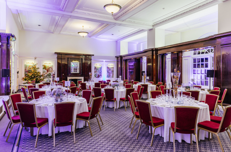 BMA House Christmas party ballroom, elegant red chairs, corporate events - Banner