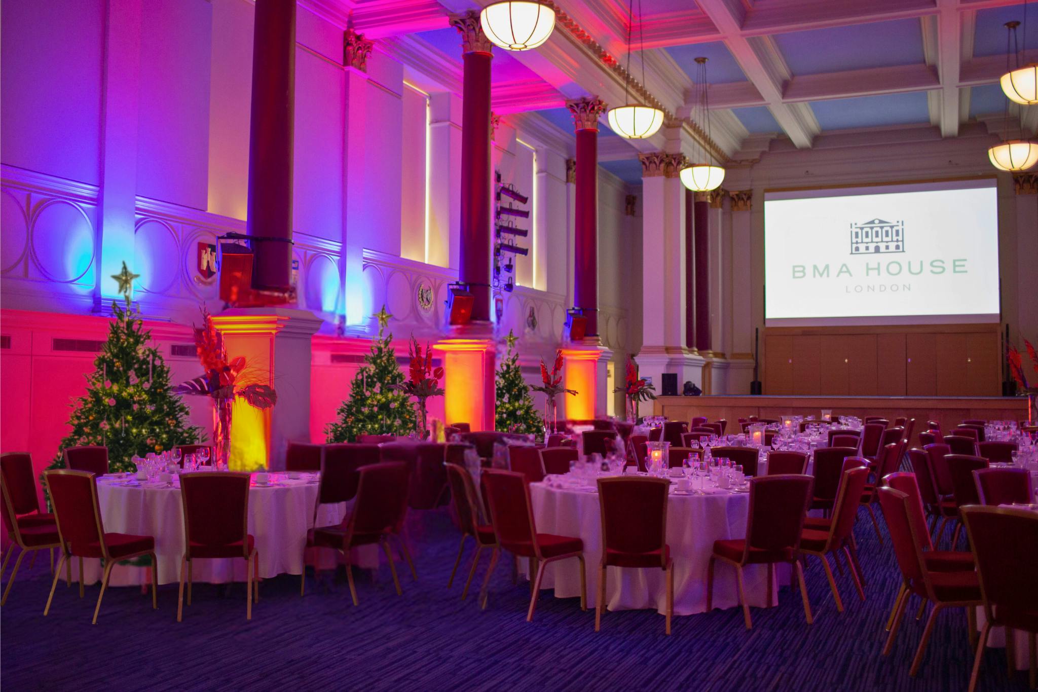 Elegant Christmas party setup at BMA House with festive decor and ambient lighting.