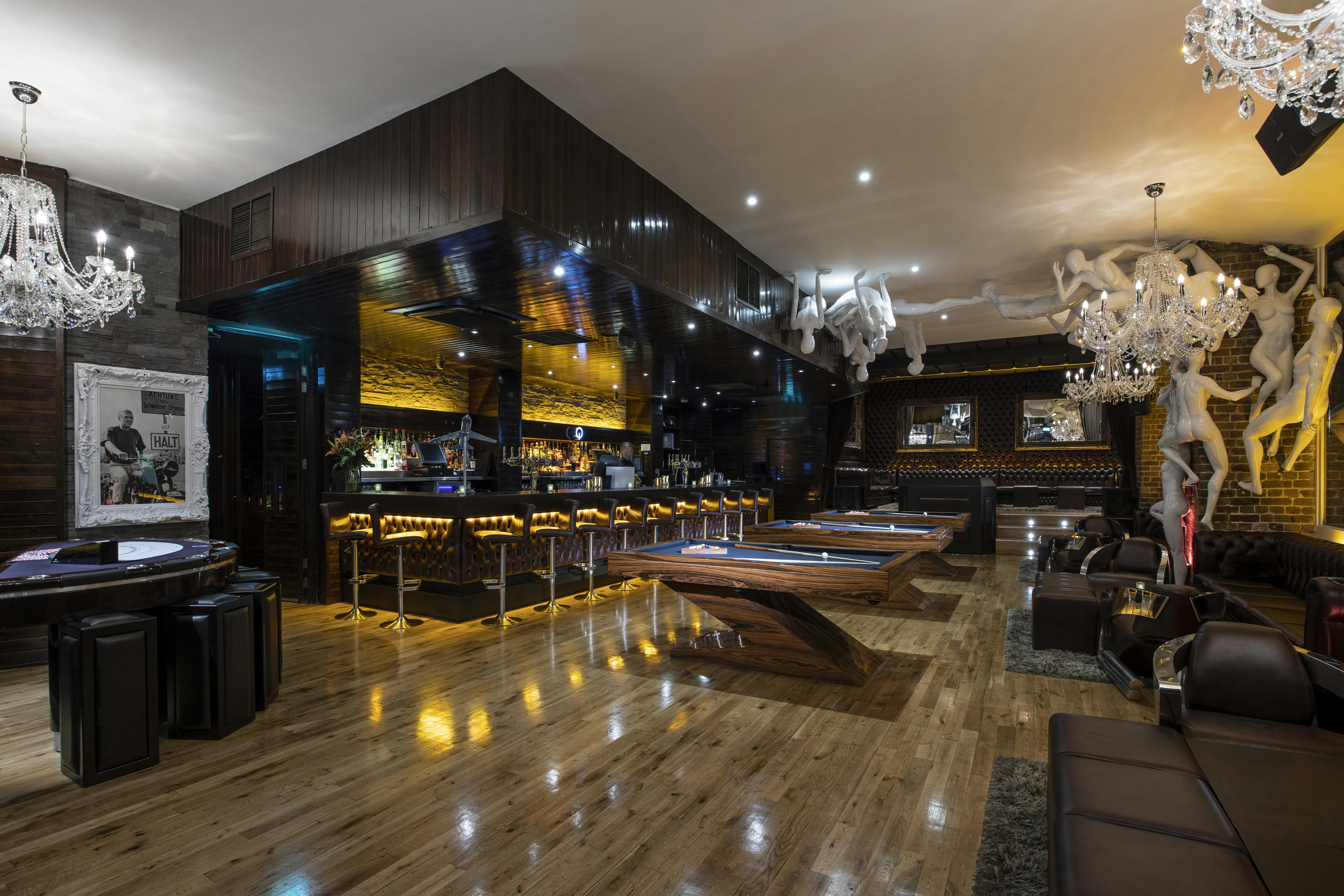 Stylish Q-Shoreditch lounge with wooden flooring, perfect for upscale events and receptions.