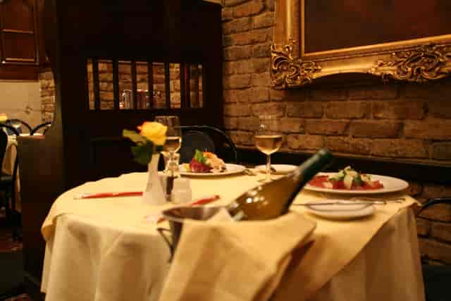 Intimate dining setup at Bolton's Restaurant for corporate dinner and networking event.