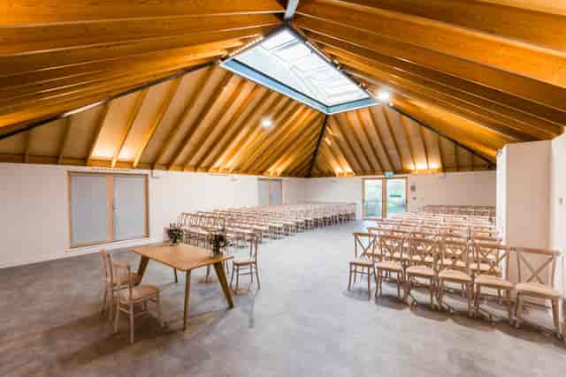 Sky Room in The Glass House, featuring a high wooden ceiling for events and presentations.