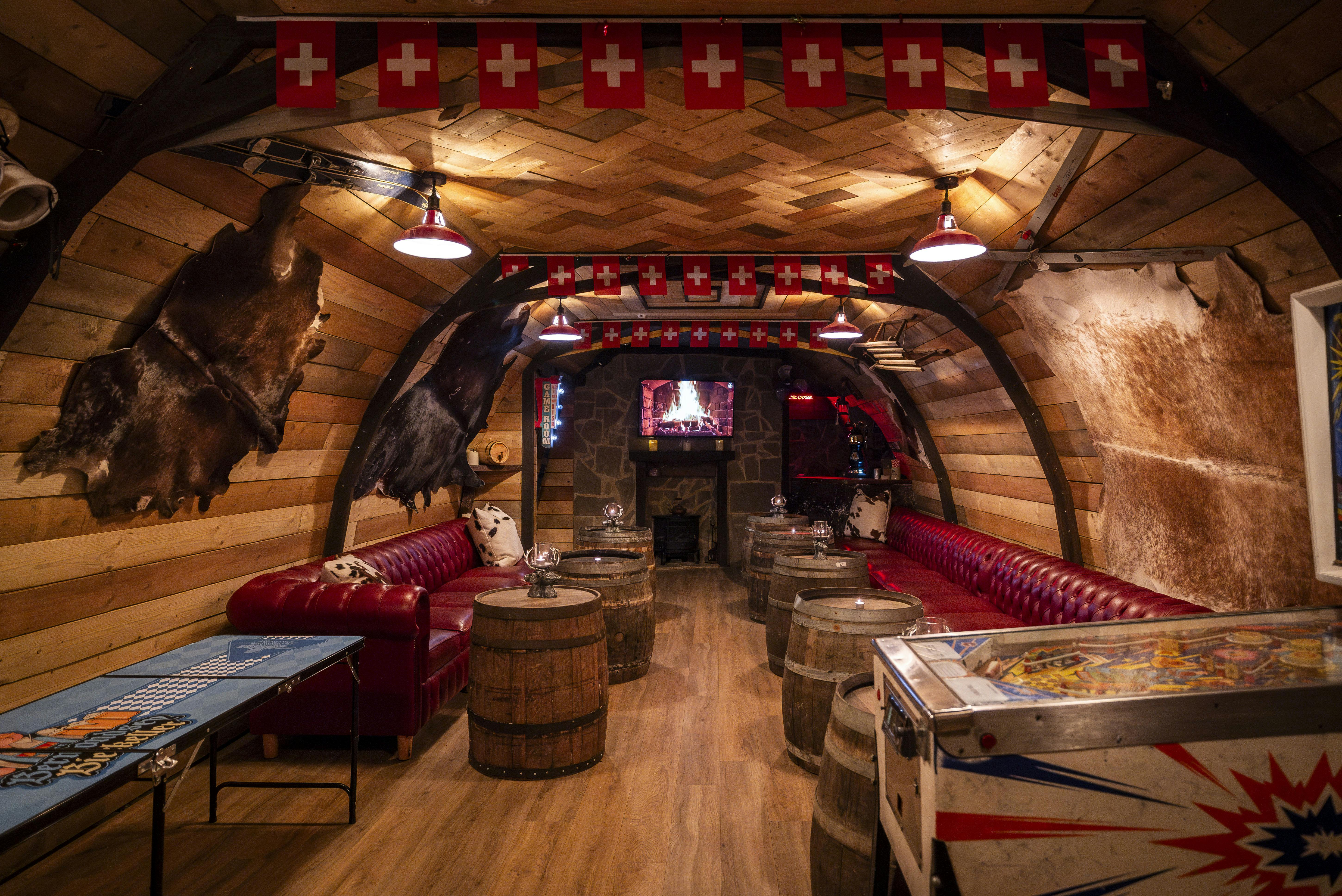 Huski Lodge at London Bridge: cozy alpine event space with rustic decor for gatherings.