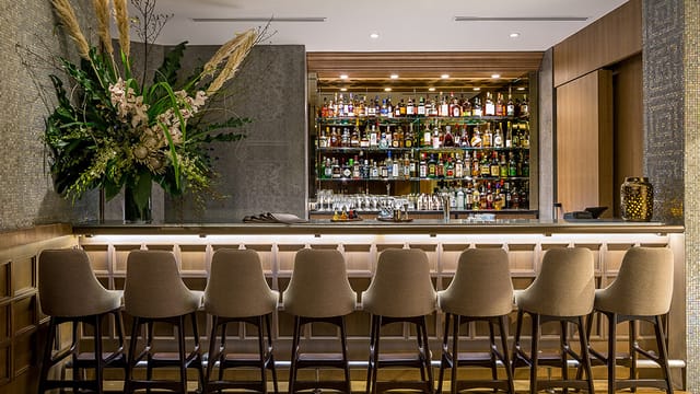 Stylish bar area at Artemis Grill & Sky Bar, perfect for networking events and gatherings.