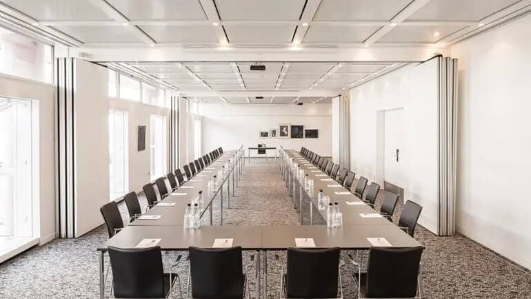 Meeting room at Imperial Hotel with U-shaped tables, ideal for conferences and workshops.