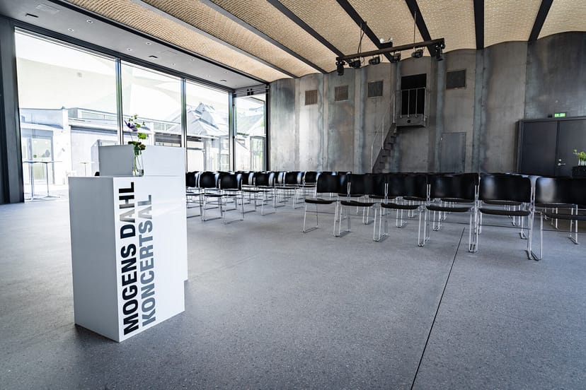Modern minimalist event space in Mogens Dahl Koncertsal for presentations and concerts.