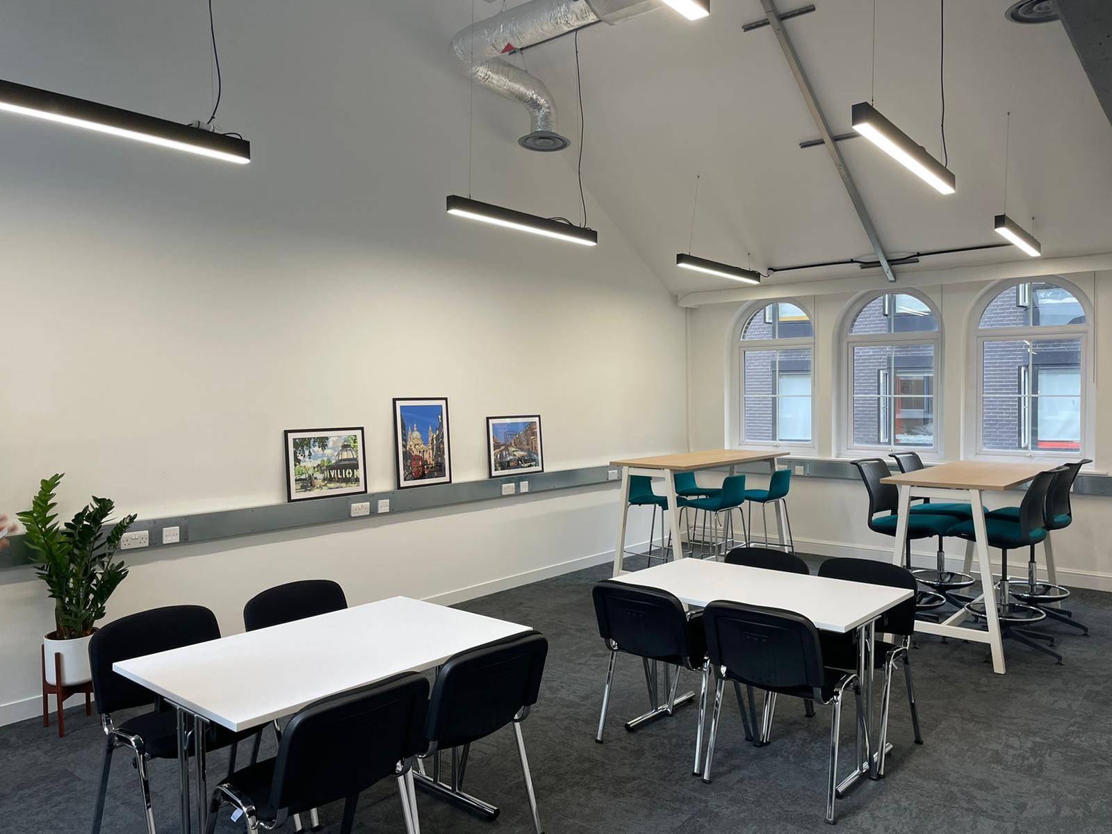 Versatile 2nd floor meeting space with natural light for events and brainstorming sessions. - Banner