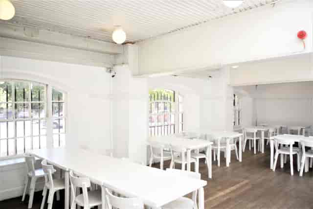 Bright minimalist ICA Bar event space with natural light, perfect for meetings and workshops.