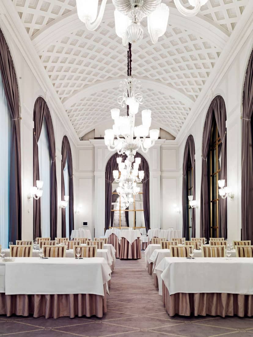 Elegant event space in Hotel d'Angleterre with chandeliers, ideal for weddings and meetings.