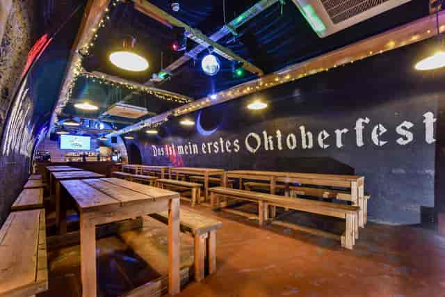 Bermondsey Bierkeller at London Bridge, rustic seating for Oktoberfest celebrations.