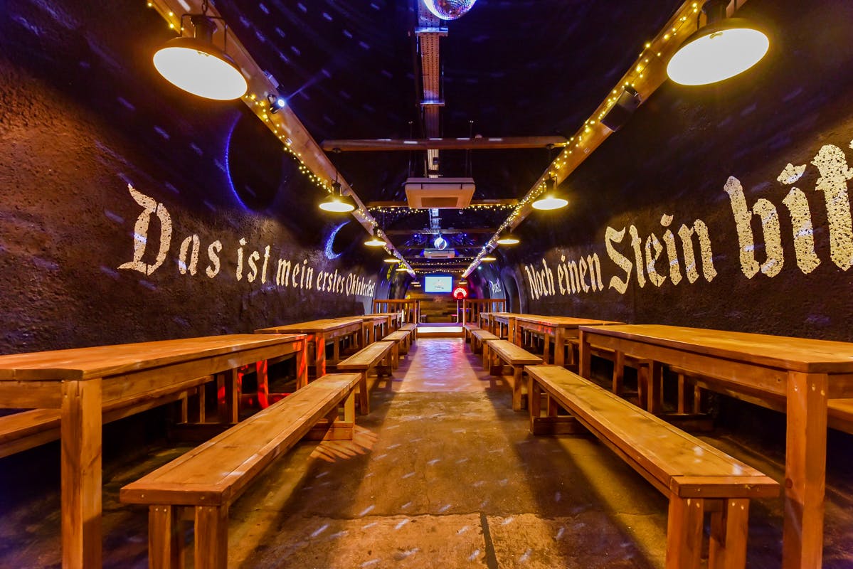 Bermondsey Bierkeller: rustic venue with wooden benches for events and gatherings.