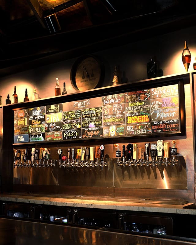 Vibrant craft beer tap wall at 2Twenty2 Tavern for networking events and gatherings.