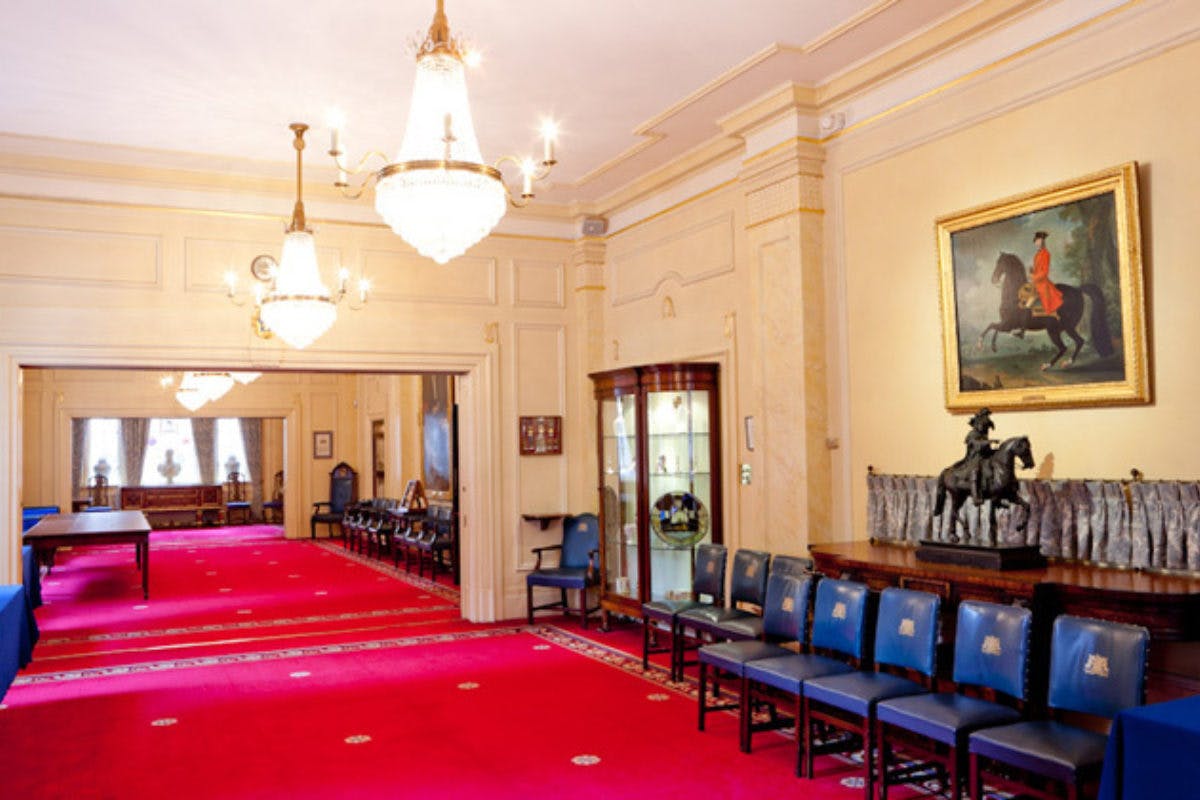 Elegant event space in Saddlers’ Hall with chandeliers, ideal for meetings and receptions.