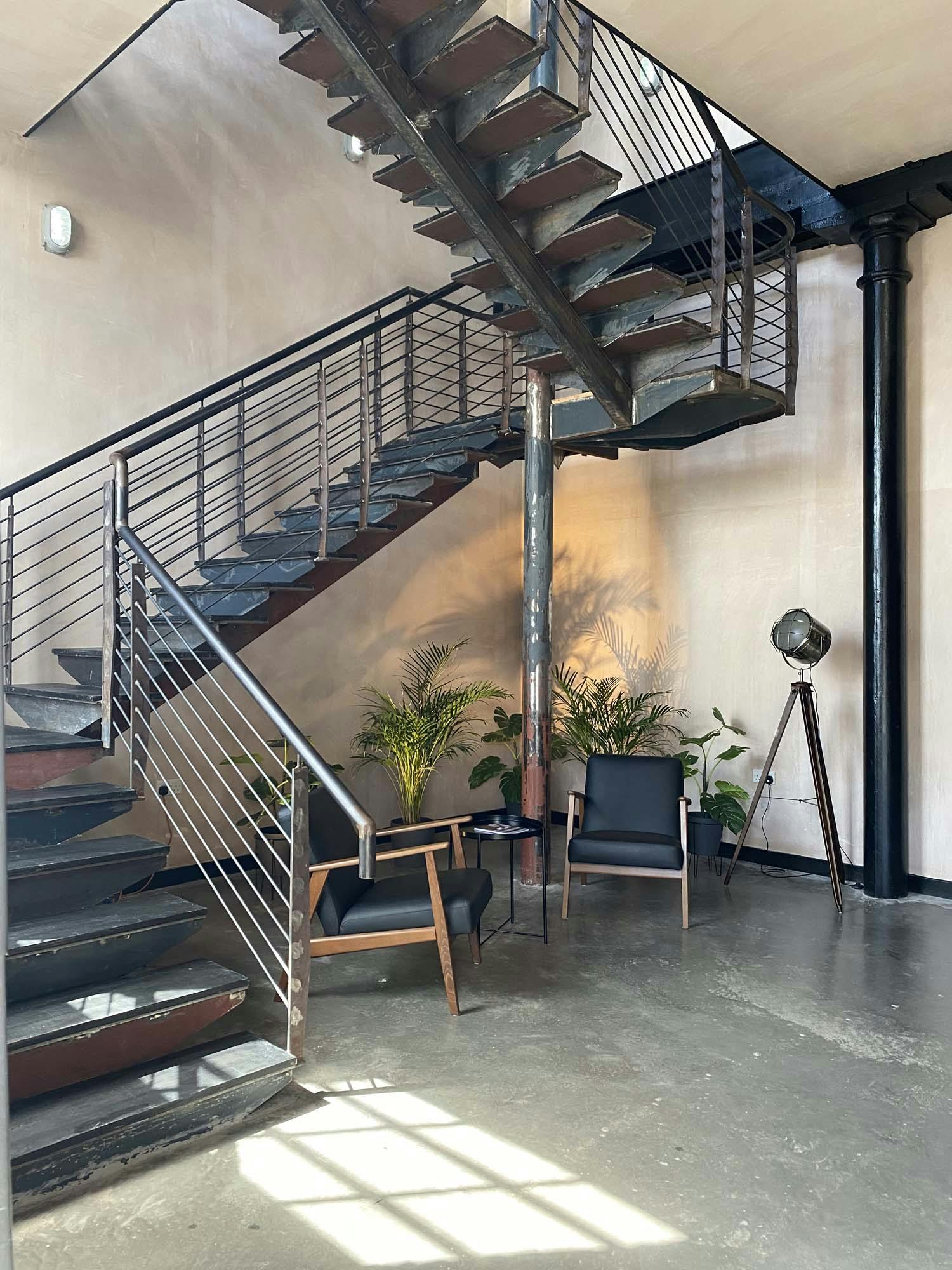 Modern staircase in The Engine Works, ideal for networking events and informal meetings.