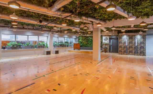 Main Lounge in Arboretum London, modern event space with wooden flooring for workshops.