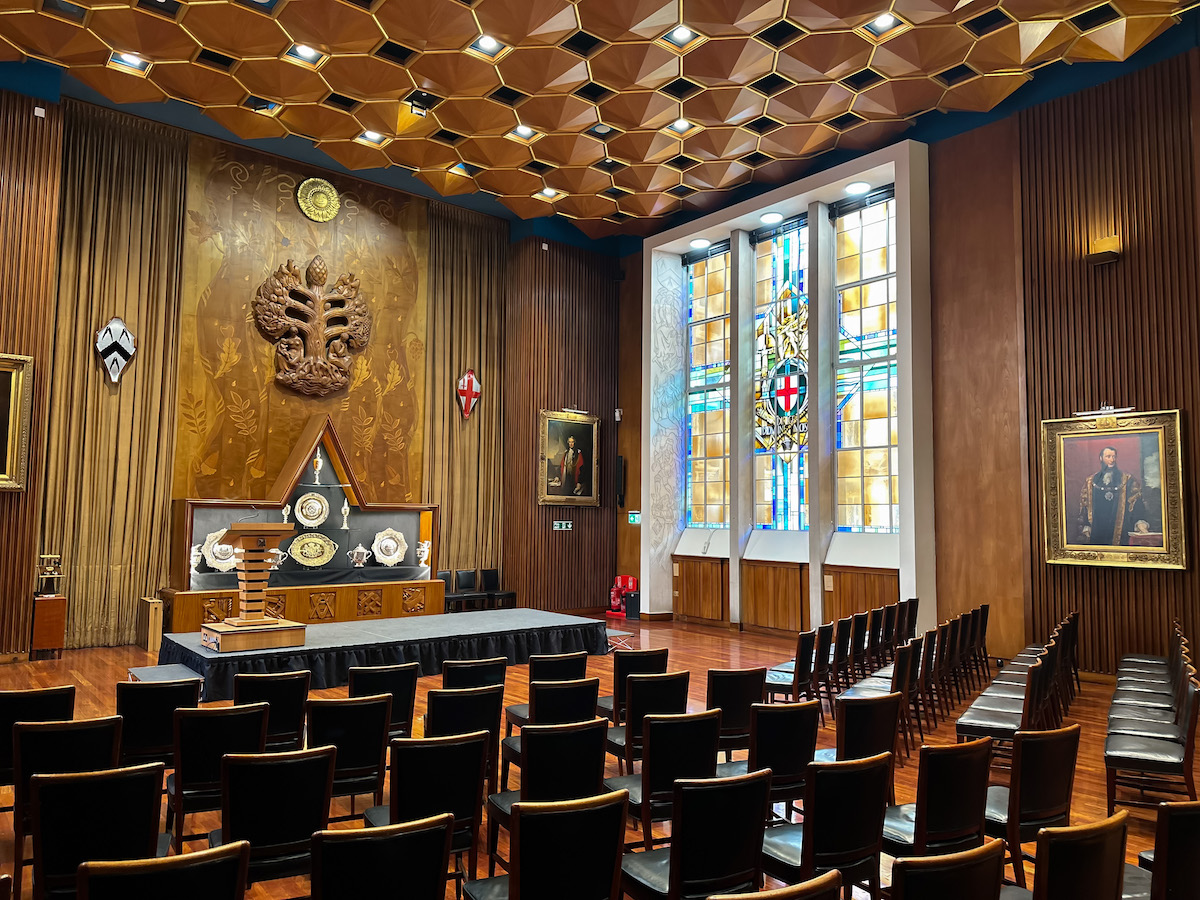 Elegant Livery Hall with wooden paneling, perfect for formal meetings and ceremonies. - Banner