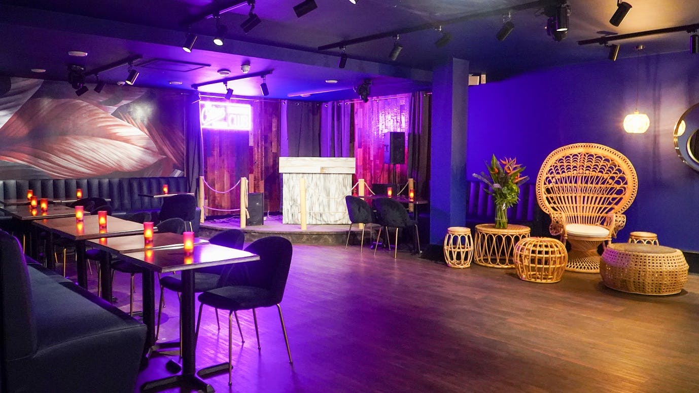 Cottons Club Shoreditch: modern event space with deep blue walls, ideal for cocktail receptions.