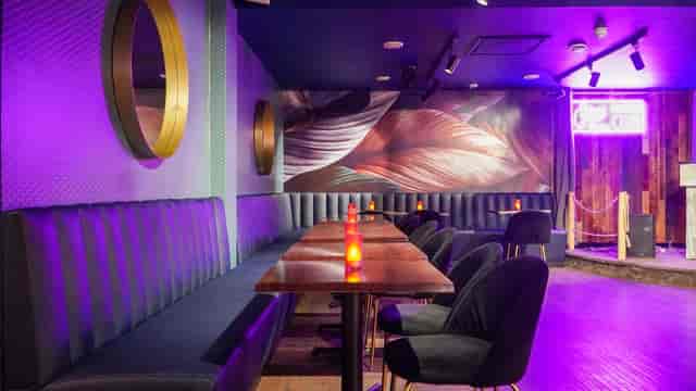 Stylish Cottons Club event space with sleek seating and ambient lighting for gatherings.