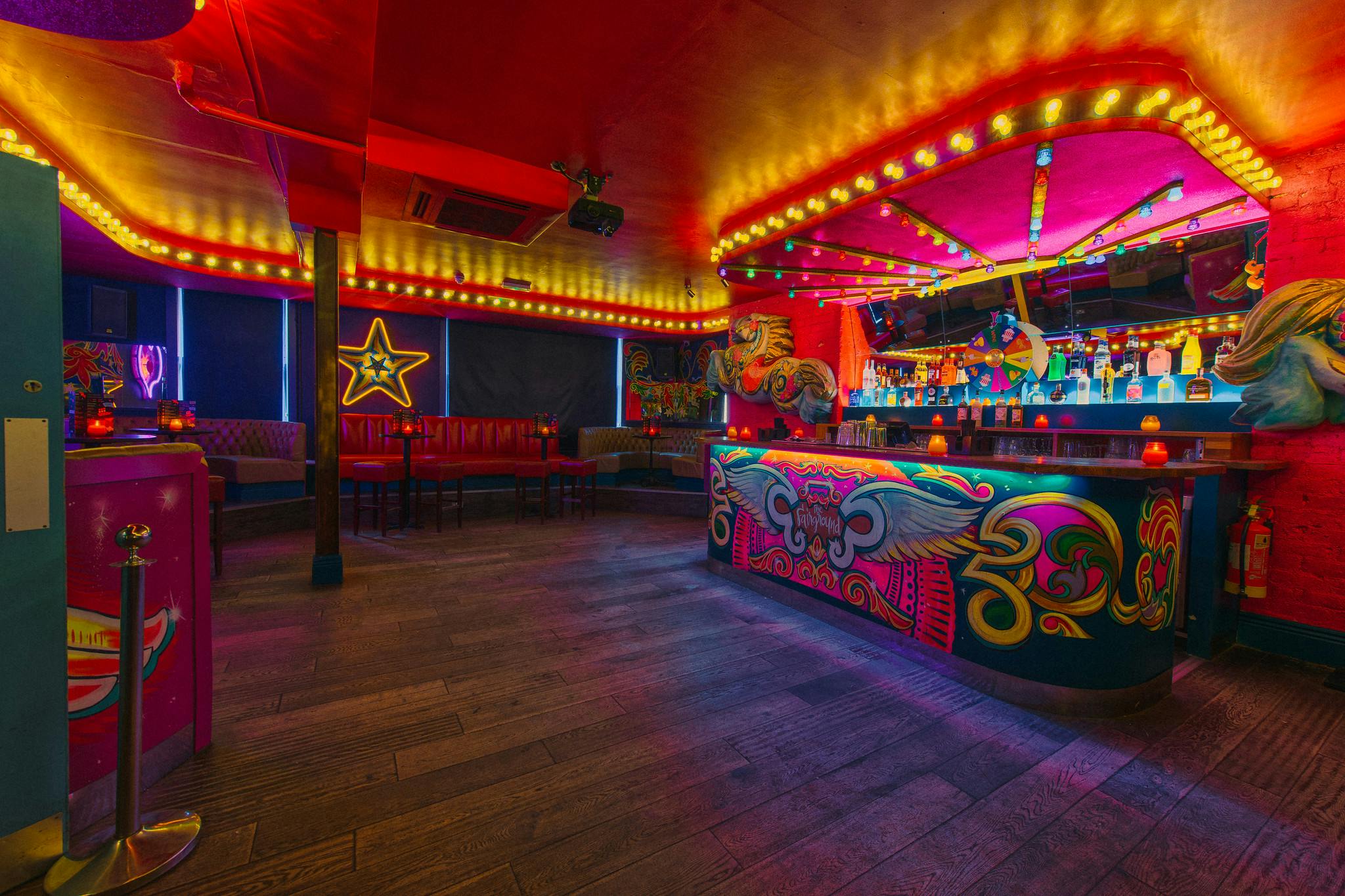 Vibrant bar space with neon lights, ideal for corporate events and parties in Cuckoo.