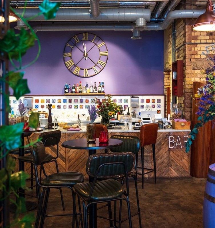 Stylish bar area in Cecilia's Wine House, perfect for networking events and casual meetings. - Banner