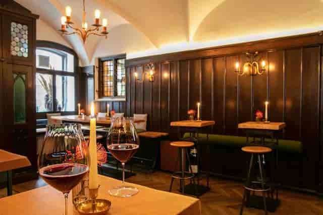 Intimate event space at Weinhaus Neuner with warm lighting, ideal for gatherings and receptions.
