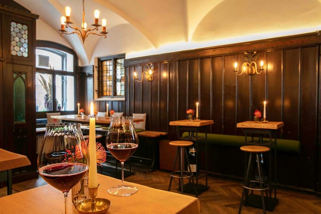 Intimate event space at Weinhaus Neuner with warm lighting, ideal for gatherings and receptions.