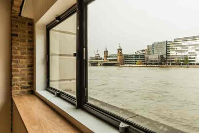 Thames Room at Glaziers Hall with large windows, ideal for meetings and events.