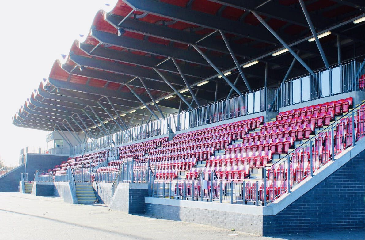 Modern athletics track seating at Basildon Sporting Village for events and performances.