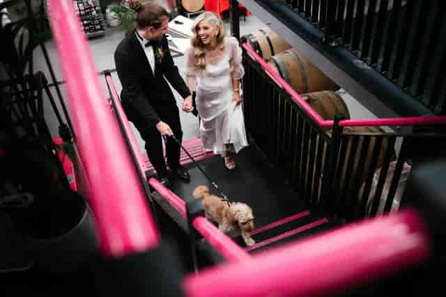 Industrial urban winery wedding venue with barrel decor for wedding reception and event space.