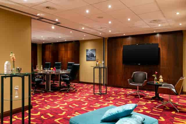 Modern meeting room at Renaissance Amsterdam Hotel with large conference table.