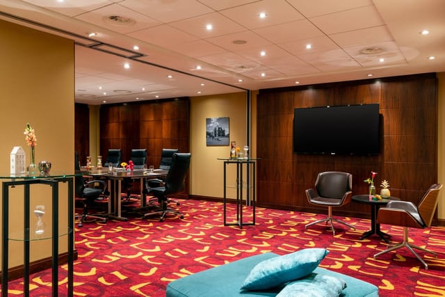 Modern meeting room at Renaissance Amsterdam Hotel with large conference table.